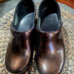 Dansko  brown patent leather clogs